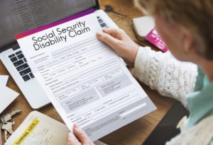 elderly woman looking at a social security disability application