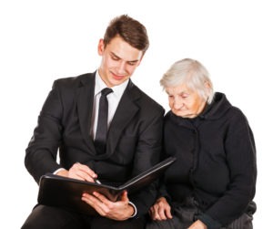 elderly woman speaking with her younger lawyer