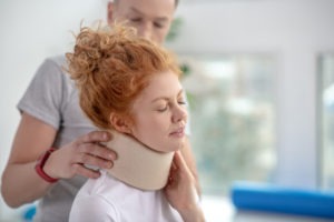 woman receiving physical therapy for a neck injury