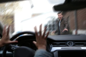 driver about to hit a young male pedestrian