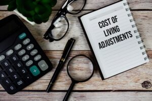 Cost,Of,Living,Adjustments,(cla),Text,On,Notepad,,Business,And