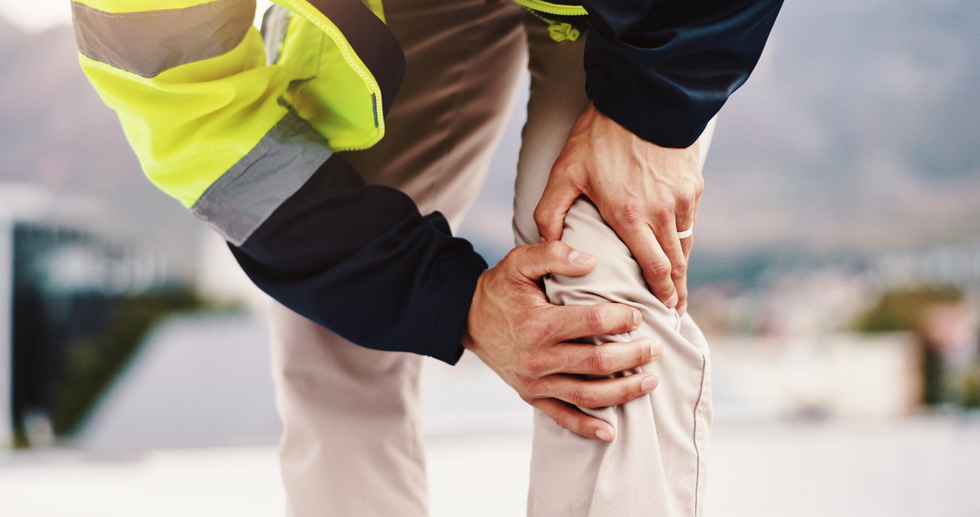 Man holding his knee in pain